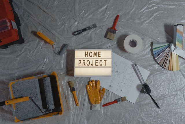 Alt-tag: Remodeling tools and a 'home project' sign.